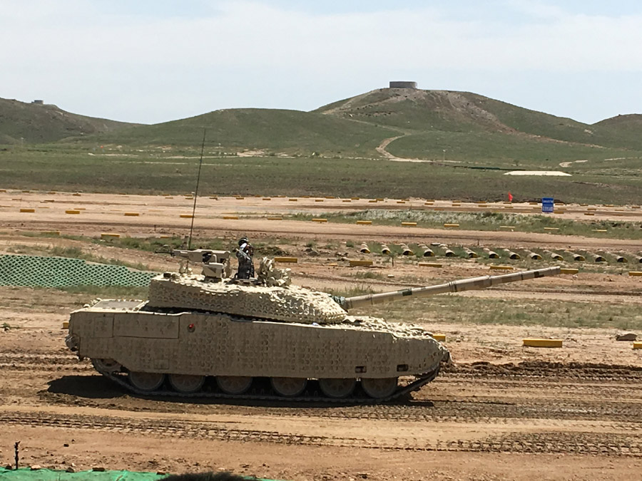 A domestically developed tank used by Chinese land forces is presented to hundreds of foreign military officers at a shooting range in the Inner Mongolia autonomous region on Aug 16, 2017. [Photo by Zhao Lei/chinadaily.com.cn]