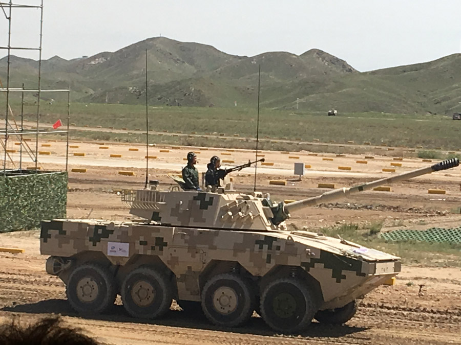 A domestically developed military vehicle used by Chinese land forces is presented to hundreds of foreign military officers at a shooting range in the Inner Mongolia autonomous region on Aug 16, 2017. [Photo by Zhao Lei/chinadaily.com.cn] 