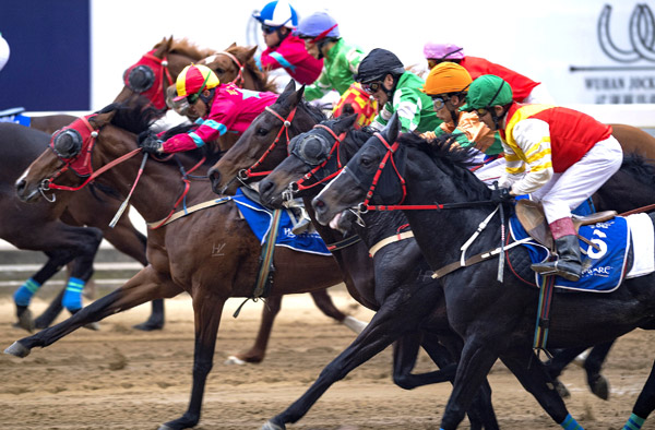 Jockeys compete in a race this year in Wuhan, Hubei province, where the local government is trying to build the country's horse racing capital.[Photo/Xinhua] 