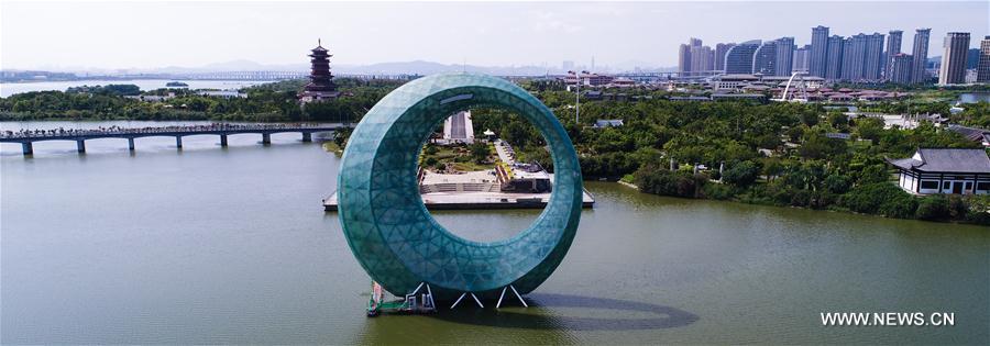 Aerial panoramic photo combined on Aug. 24, 2017 shows a part of Xiamen, a coastal city in southeast China&apos;s Fujian Province. The BRICS summit and the Dialogue of Emerging Markets and Developing Countries are to be held here from Sept. 3 to 5. (Xinhua/Wang Jianhua)