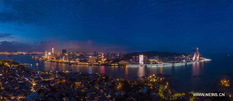 Aerial panoramic photo combined on Aug. 24, 2017 shows a part of Xiamen, a coastal city in southeast China&apos;s Fujian Province. The BRICS summit and the Dialogue of Emerging Markets and Developing Countries are to be held here from Sept. 3 to 5. (Xinhua/Song Weiwei)