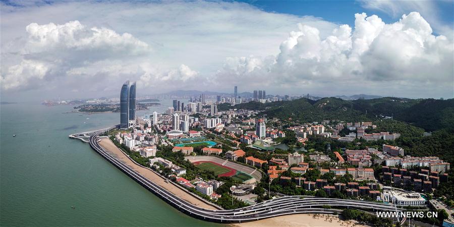 Aerial panoramic photo combined on Aug. 24, 2017 shows a part of Xiamen, a coastal city in southeast China&apos;s Fujian Province. The BRICS summit and the Dialogue of Emerging Markets and Developing Countries are to be held here from Sept. 3 to 5. (Xinhua/Li Xin)