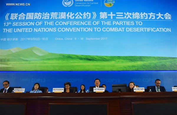 Zhang Jianlong (3rd R, front), head of China's State Forestry Administration, acts as the president of the 13th Session of the Conference of the Parties (COP 13) to the United Nations Convention to Combat Desertification (UNCCD) in Ordos, north China's Inner Mongolia Autonomous Region, Sept. 6, 2017. 
