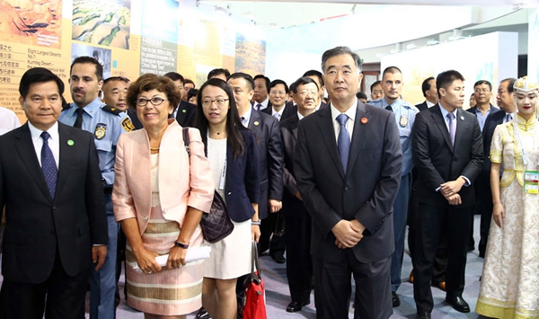 Chinese Vice-Premier Wang Yang (right) and Executive Secretary of UNCCD Monique Barbut (second from left) attend the opening ceremony of the High Level Segment, Ordos, Inner Mongolia, on Sept 11, 2017. [Photo by Zou Hong/China Daily]