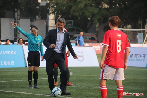 Danish Crown Prince Frederik kicks off the final of the 3rd Sino-Nordic Cup Football Tournament in Beijing, capital of China, Sept. 23, 2017. [Photo by Zhang Liying/ China.org.cn]
