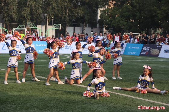 Kids from Beijing’s Shijia Experimental School perform a cheerleading show at the final of the 3rd Sino-Nordic Cup Football Tournament held in Beijing Foreign Studies University on Sept. 23, 2017. [Photo by Zhang Liying/ China.org.cn]