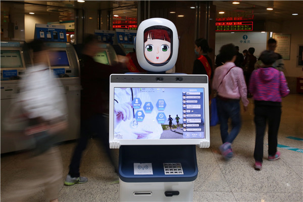The first AI healthcare robot is introduced at a hospital in Hangzhou, Zhejiang province. [Photo by Long Wei/For China Daily] 