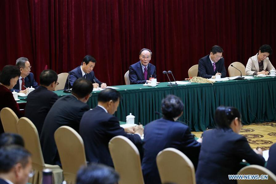 Wang Qishan speaks during a panel discussion with delegates from Hunan Province who attend the 19th National Congress of the Communist Party of China (CPC) held in Beijing, capital of China, Oct. 19, 2017. (Xinhua/Yao Dawei)