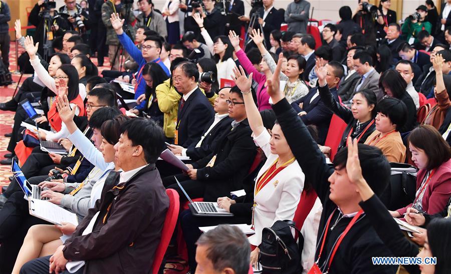 Journalists are seen at a press conference held by the press center of the 19th National Congress of the Communist Party of China (CPC) in Beijing, capital of China, Oct. 22, 2017.