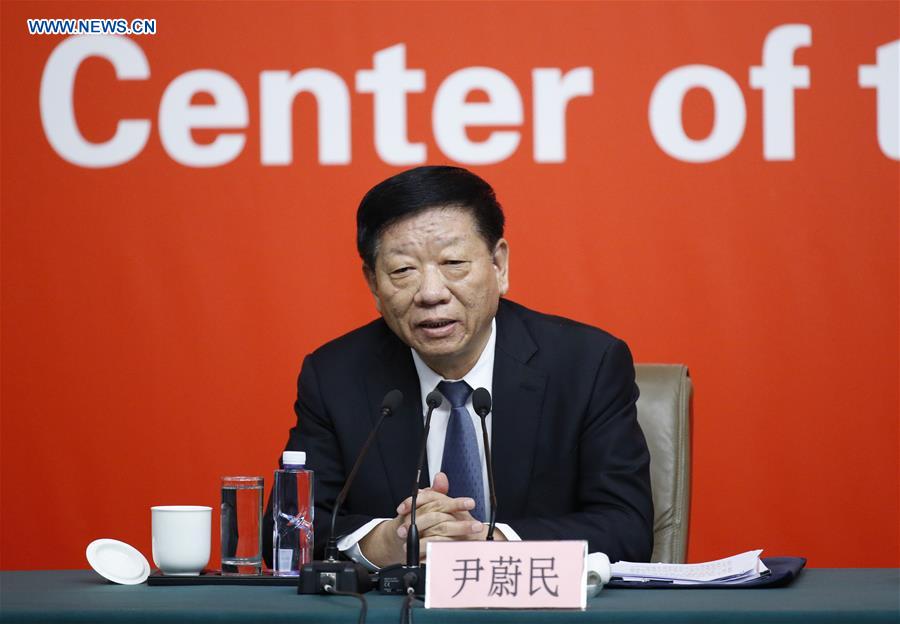 China's Minister of Human Resources and Social Security Yin Weimin speaks at a press conference held by the press center of the 19th National Congress of the Communist Party of China (CPC) in Beijing, capital of China, Oct. 22, 2017. The press conference was themed on securing and improving people's livelihood. [Photo/Xinhua]