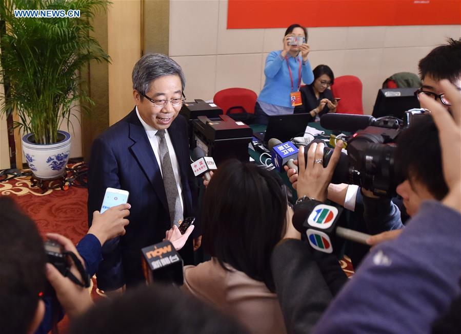 China's Minister of Education Chen Baosheng receives an interview after a press conference held by the press center of the 19th National Congress of the Communist Party of China (CPC) in Beijing, capital of China, Oct. 22, 2017. The press conference was themed on securing and improving people's livelihood. [Photo/Xinhua]