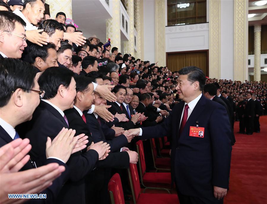 Xi Jinping, general secretary of the Communist Party of China (CPC) Central Committee, who is also Chinese president and chairman of the Central Military Commission, meets with delegates, specially invited delegates and non-voting participants of the 19th CPC National Congress at the Great Hall of the People in Beijing, capital of China, Oct. 25, 2017. (Xinhua/Lan Hongguang) 