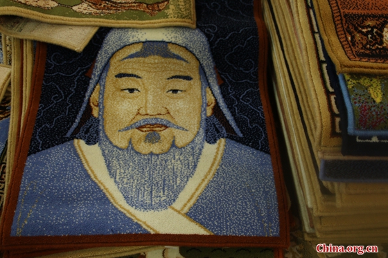 A carpet with a woven image of Genghis Khan designed by Abu. [Photo by Zhao Shan/China.org.cn]