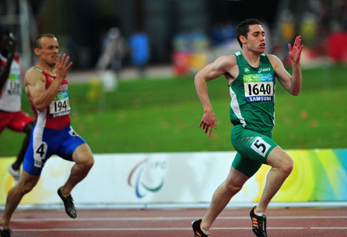 Jason Smyth of Ireland (R) wins the gold medal in the Men's 200m T13. 