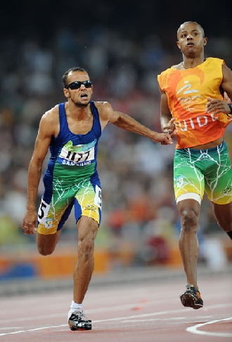 Lucas Prado of Brazil wins the gold medal in the Men's 400m T11. 