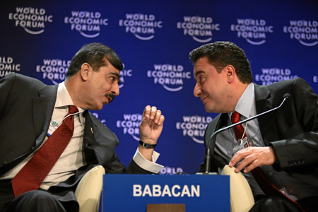 Syed Yousaf Raza Gillani (L), prime minister of Pakistan, talks with Ali Babacan, minister of foreign affairs of Turkey, during the session 'Pakistan and Its Neighbours' at the Annual Meeting 2009 of the World Economic Forum (WEF) in Davos, Switzerland, on January 29, 2009. [Xinhua]