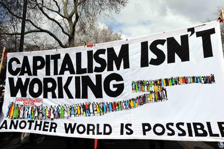 A banner is displayed during a demonstration in London on March 28, 2009. The Put People First group, an alliance of more than 150 unions, on Saturday organized the demonstration, calling on the leaders of the Group of 20 Countries (G20) to adopt sustainable policies that can lead the world out of recession.