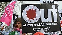 A little girl attends a demonstration in London on March 28, 2009. The Put People First group, an alliance of more than 150 unions, on Saturday organized the demonstration, calling on the leaders of the Group of 20 Countries (G20) to adopt sustainable policies that can lead the world out of recession. The demonstrators also urged the leaders to attach importance to global environment protection and to stablize the world political situation.