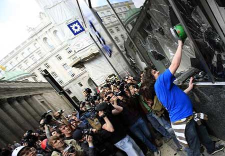 G20 protesters smash windows of the Bank of England in the City of London, on April 1, 2009.