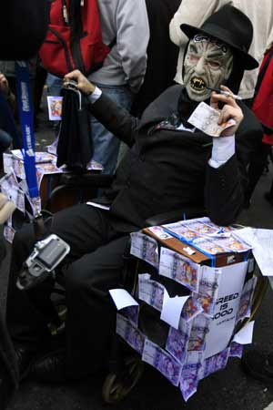 A dressed-up protester takes part in a protest near the Bank of England in London, Britain, on April 1, 2009. 