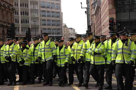 British police wearing fluorescent jackets keep order in London, Britain, on April 1, 2009.