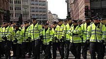 British police wearing fluorescent jackets keep order in London, Britain, on April 1, 2009.
