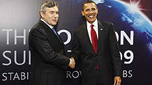 United States President Barack Obama (R) arrives at ExCel center and is greeted by British Prime Minister Gordon Brown for the summit of the Group of 20 Countries (G20) in London on April 2, 2009.
