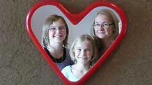 Flora (L) and Valentina (C) pose for a group photo with their mother at their home in Purkersdorf, a town of Lower Austria, Austria, on October 4, 2009.