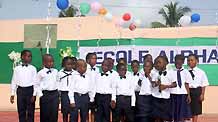 Pupils sing during a celebration for the Universal Children's Day in Lome, capital of Togo, November 18, 2009. Teachers and pupils of a primary school in Lome held the celebration to mark the Universal Children's Day and commemorate the 20th anniversary of the adoption of 'Convention on the Rights of the Child'.