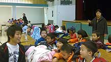 Students attend class at a Chinese-language school in Toronto October 31, 2009.