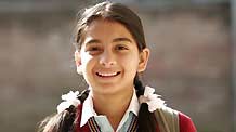 Jyoti Upreti walks to school in Kathmandu, capital of Nepal, on October 28, 2009. Jyoti Uprety is an 11-year-old girl studying in the 6th grade of a local elementary school in Kathmandu.