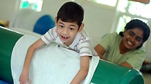 A special child is trained at Tasputra in Kuala Lumpur, Malaysia, on November 20, 2009.
