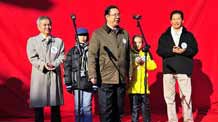 Zhou Xisheng (C-Front), vice president of Xinhua News Agency addresses the launching ceremony of a photo exhibition titled 'The World's Children and the Children's World' in Beijing, November 20, 2009. The exhibition, which marks the Universal Children's Day, is sponsored by Xinhua News Agency and is based on the theme of 'The World in Children's Eyes' and 'Children's Stories.' About 500 photos taken by global children, reporters and contract photographers of the agency were displayed during the exhibition.