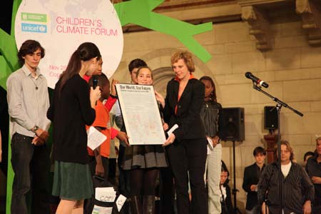 Delegates submit the Children&apos;s Climate Forum Declaration to Denmark&apos;s Minister for Climate and Energy Connie Hedegaard during the closing ceremony of a forum in Copenhagen, Denmark, on December 4, 2009.