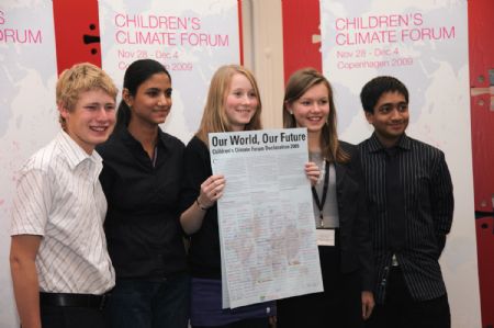 Delegates show the Children&apos;s Climate Forum Declaration during the closing ceremony of a forum in Copenhagen, Denmark, on December 4, 2009. 