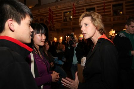 Denmark&apos;s Minister for Climate and Energy Connie Hedegaard talks to Chinese delegates during the closing ceremony of a forum in Copenhagen, Denmark, on December 4, 2009. 