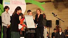Delegates submit the Children's Climate Forum Declaration to Denmark's Minister for Climate and Energy Connie Hedegaard during the closing ceremony of a forum in Copenhagen, Denmark, on December 4, 2009.