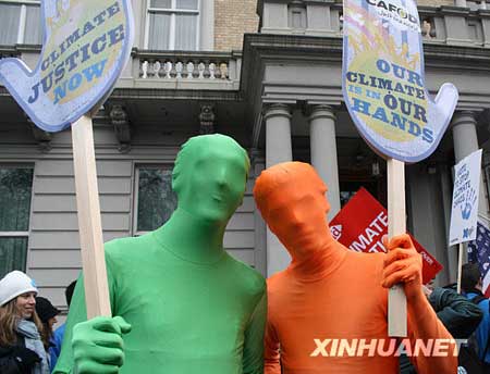 People take part in a demonstration in London, capital of Britain, on December 5, 2009. Thousands of people on Saturday attended the demonstration calling for the support for coping with climate changes ahead of the 15th United Nations Climate Change Conference.