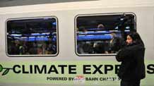 A cameraman shoots the 'Climate Express' in Brussels, capital of Belgium, December 5, 2009.