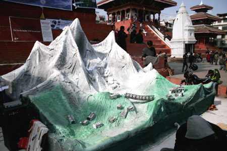 A replica of the Himalayan region is displayed at an exhibition on the Basantapur Durbar Square in Kathmandu, capital of Nepal, December 6, 2009. 