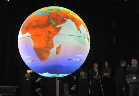 A globe depicting global warming is seen inside the United Nations Climate Change Conference center in Copenhagen December 7, 2009.