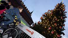 A boy rides a bicycle to light a Christmas tree in Copenhagen, Denmark, on December 8, 2009.