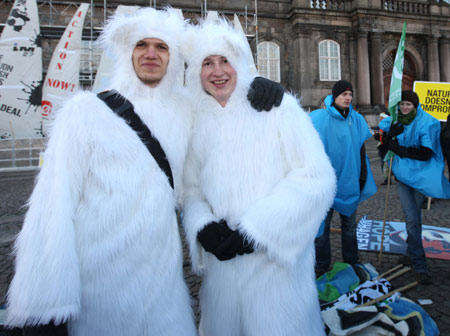 Environmentalists dressed as polar bears attend the Global Day of Action at parliament square in Copenhagen, capital of Denmark, on December 12, 2009. 