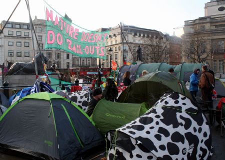 Environmentalists protest in tents at the Trafalgar Square in downtown London, Britain, December 12, 2009. 