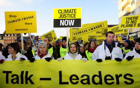 Environmentalists march to Bella Center, the venue of the United Nations Climate Change Conference, in Copenhagen, Denmark, December 12, 2009. 