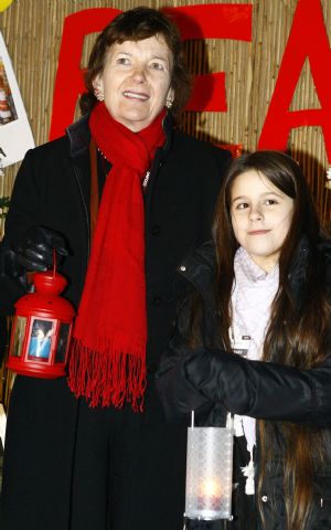 Former Irish president Mary Robinson (L) takes part in a vigil reminding people to pay attention to the global warming, at Bella Center, the venue of the UN climate change conference, on the outskirts of the Danish capital Copenhagen, December 12, 2009. 