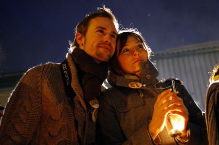 A pair of lovers take part in a vigil reminding people to pay attention to the global warming, at Bella Center, the venue of the UN climate change conference, on the outskirts of the Danish capital Copenhagen, December 12, 2009.