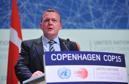 Danish Prime Minister Lars Lokke Rasmussen addresses the opening ceremony of the high-level segment of UN Climate Change Conference in Copenhagen, capital of Denmark, December 15, 2009.