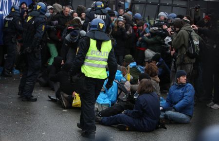 Protesters are detained outside Bella center in Copenhagen, Denmark, December 16, 2009. 