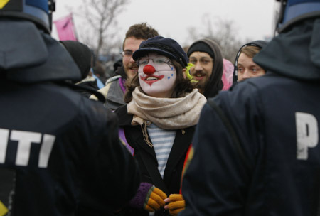 Protesters stand face to face with policemen outside Bella center in Copenhagen, Denmark, December 16, 2009. 